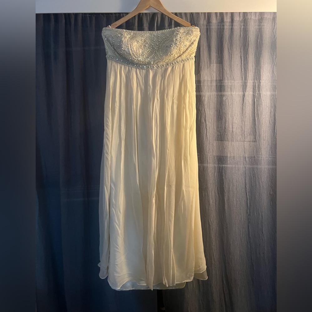 Elegant strapless cream gown with beaded top